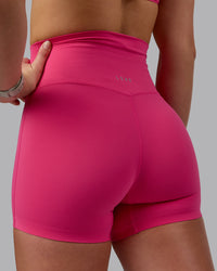 Woman wearing Elixir Ultra High-Rise 4" Short - Pink Flash | Model:Chloe | Size:XS | Thumbnail Index: 8