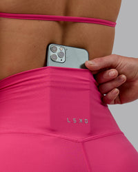 Woman wearing Elixir Ultra High-Rise 4" Short - Pink Flash | Model:Chloe | Size:XS | Thumbnail Index: 2