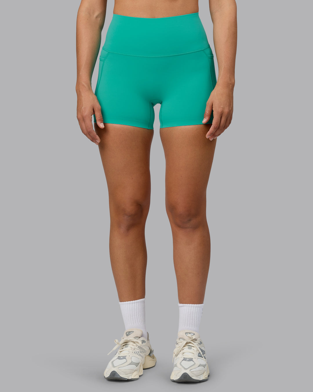 Woman wearing Elixir Ultra High-Rise 4" Short Pockets - Atlantis | Model:Sophie | Size:S - view 8