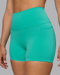 Woman wearing Elixir Ultra High-Rise 4" Short Pockets - Atlantis | Model:Sophie | Size:S | Thumbnail Index: 9