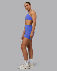 Woman wearing Elixir Ultra High-Rise 4" Short Pockets - Baja Blue | Model:Sophie | Size:S | Thumbnail Index: 4
