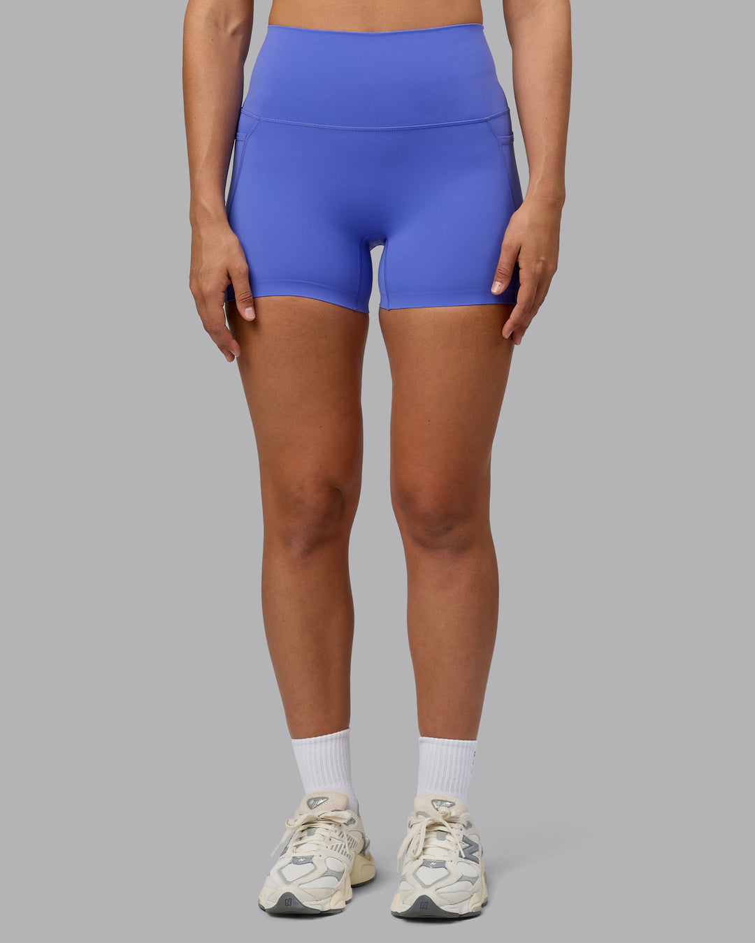 Woman wearing Elixir Ultra High-Rise 4" Short Pockets - Baja Blue | Model:Sophie | Size:S - view 8