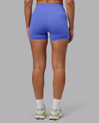 Woman wearing Elixir Ultra High-Rise 4" Short Pockets - Baja Blue | Model:Sophie | Size:S | Thumbnail Index: 5