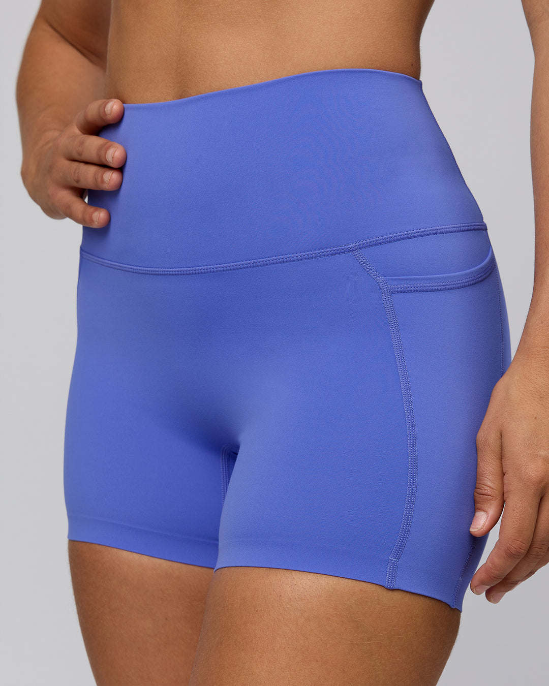 Woman wearing Elixir Ultra High-Rise 4" Short Pockets - Baja Blue | Model:Sophie | Size:S - view 7