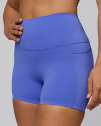 Woman wearing Elixir Ultra High-Rise 4" Short Pockets - Baja Blue | Model:Sophie | Size:S | Thumbnail Index: 6