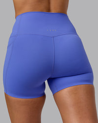 Woman wearing Elixir Ultra High-Rise 4" Short Pockets - Baja Blue | Model:Sophie | Size:S | Thumbnail Index: 3