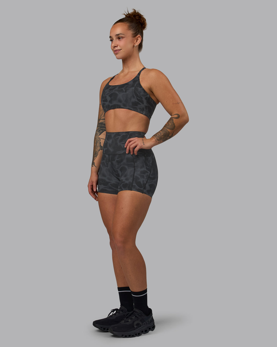 Woman wearing Elixir Ultra High-Rise 4" Short Pockets - Tranquil-Black | Model:Robyn | Size:S - view 3