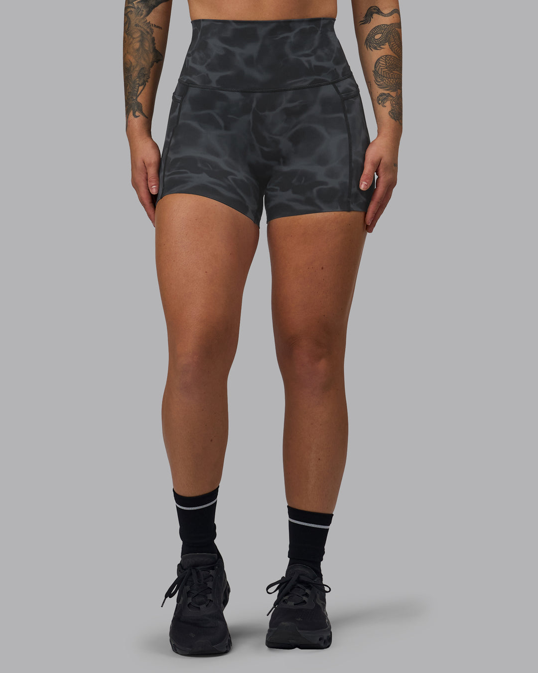 Woman wearing Elixir Ultra High-Rise 4" Short Pockets - Tranquil-Black | Model:Robyn | Size:S - view 5