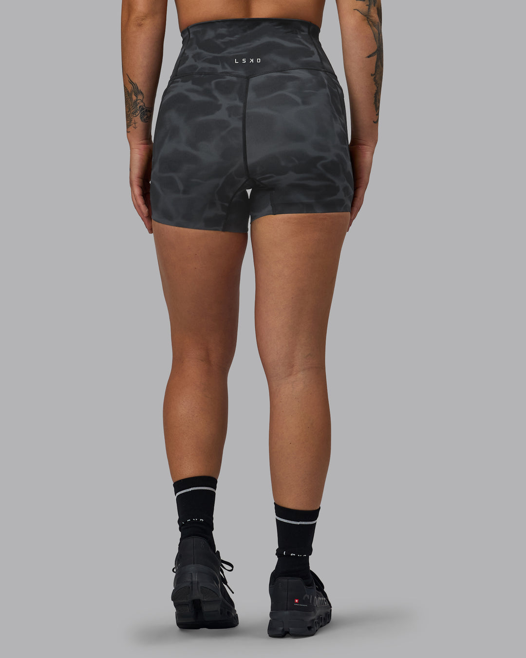 Woman wearing Elixir Ultra High-Rise 4" Short Pockets - Tranquil-Black | Model:Robyn | Size:S - view 4