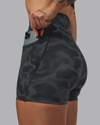 Woman wearing Elixir Ultra High-Rise 4" Short Pockets - Tranquil-Black | Model:Robyn | Size:S | Thumbnail Index: 9
