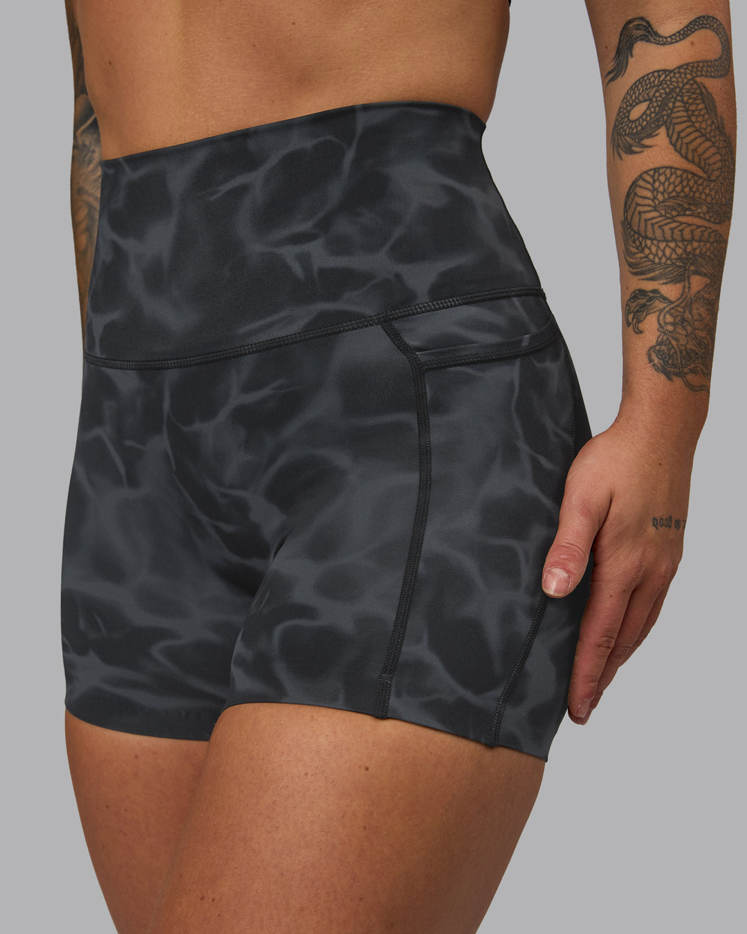Woman wearing Elixir Ultra High-Rise 4" Short Pockets - Tranquil-Black | Model:Robyn | Size:S - view 8
