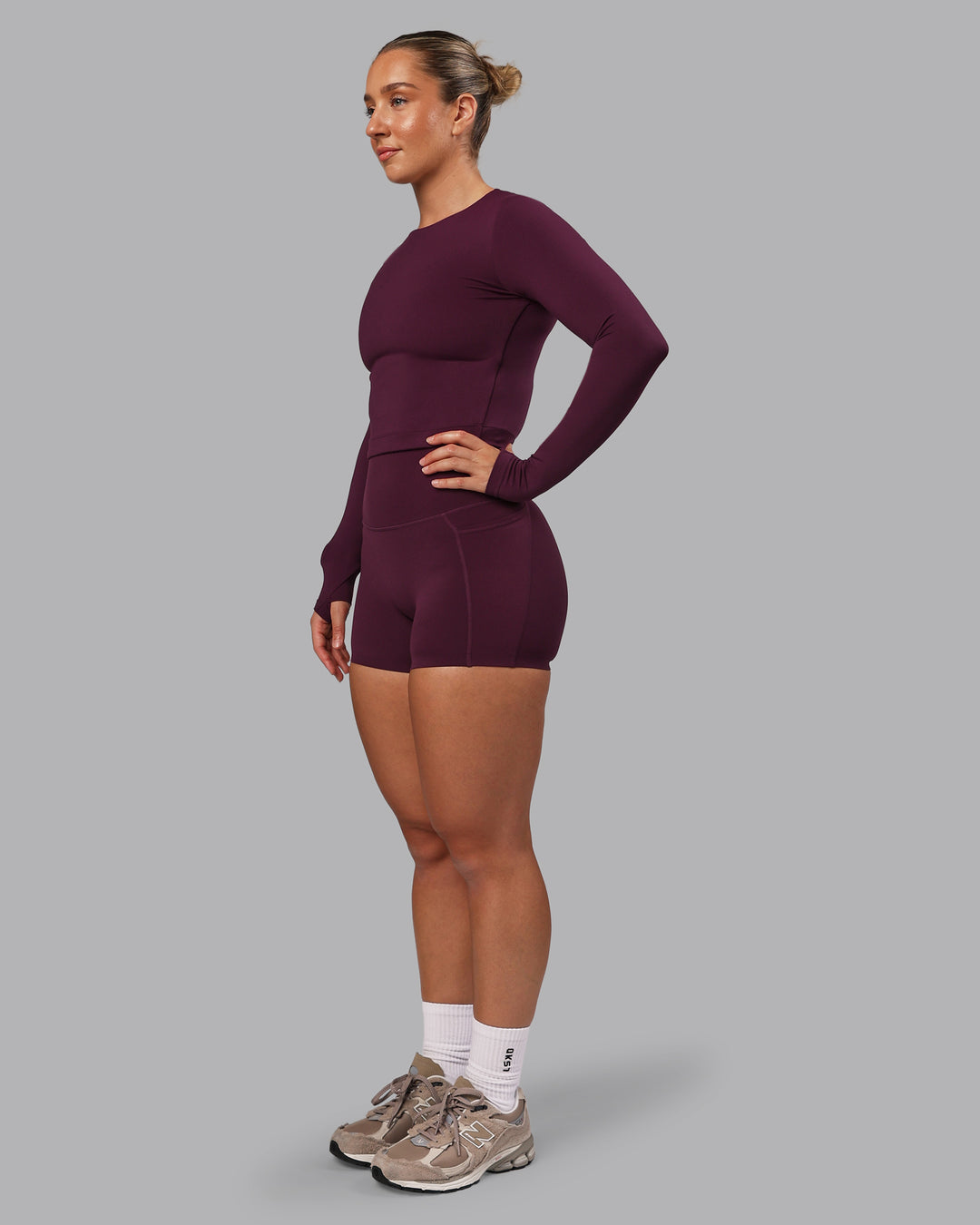 Woman wearing Elixir Ultra High-Rise 4" Short Pockets - Cherry Lacquer | Model:Lyss | Size:S - view 3