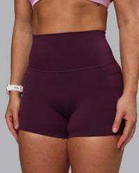 Woman wearing Elixir Ultra High-Rise 4" Short Pockets - Cherry Lacquer | Model:Lyss | Size:S | Thumbnail Index: 1
