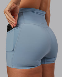 Woman wearing Elixir Ultra High-Rise 4" Short Pockets - Glacier Lake | Model:Lyss | Size:S | Thumbnail Index: 5
