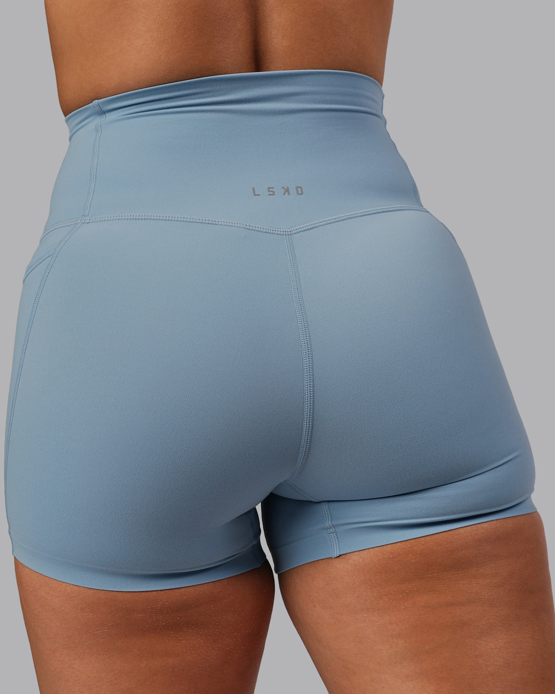 Woman wearing Elixir Ultra High-Rise 4" Short Pockets - Glacier Lake | Model:Lyss | Size:S - view 9