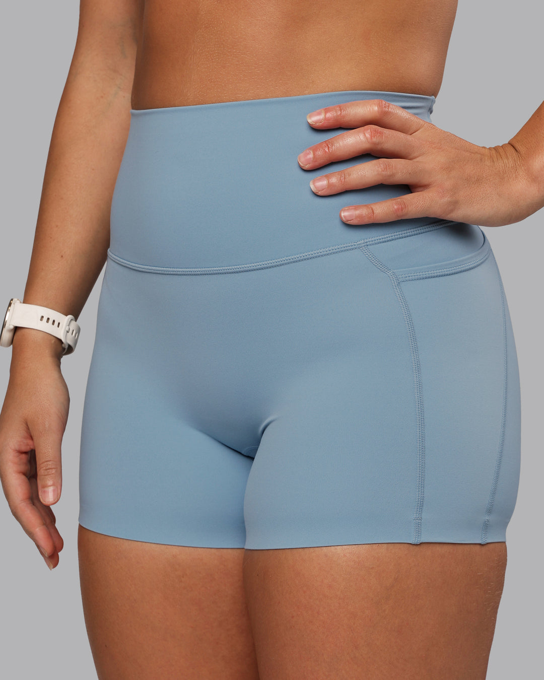 Woman wearing Elixir Ultra High-Rise 4" Short Pockets - Glacier Lake | Model:Lyss | Size:S - view 8