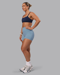 Woman wearing Elixir Ultra High-Rise 4" Short Pockets - Glacier Lake | Model:Lyss | Size:S | Thumbnail Index: 4