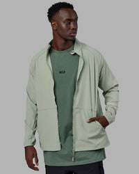 Man wearing Energy Stretch Performance Jacket - Iceberg Green | Thumbnail Index: 4