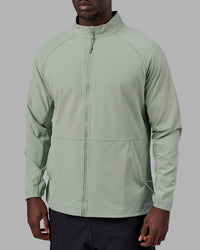 Man wearing Energy Stretch Performance Jacket - Iceberg Green | Thumbnail Index: 1