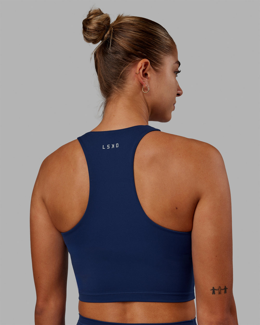 Woman wearing Enhance Shelf Bra Tank - Midnight Blue - view 3