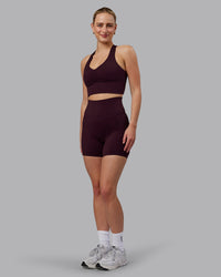Woman wearing Evoke Sports Bra - Mulberry | Thumbnail Index: 4