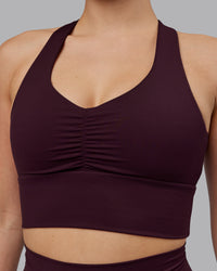 Woman wearing Evoke Sports Bra - Mulberry | Thumbnail Index: 5