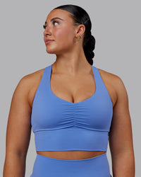 Woman wearing Evoke Sports Bra - Ultramarine | Thumbnail Index: 5