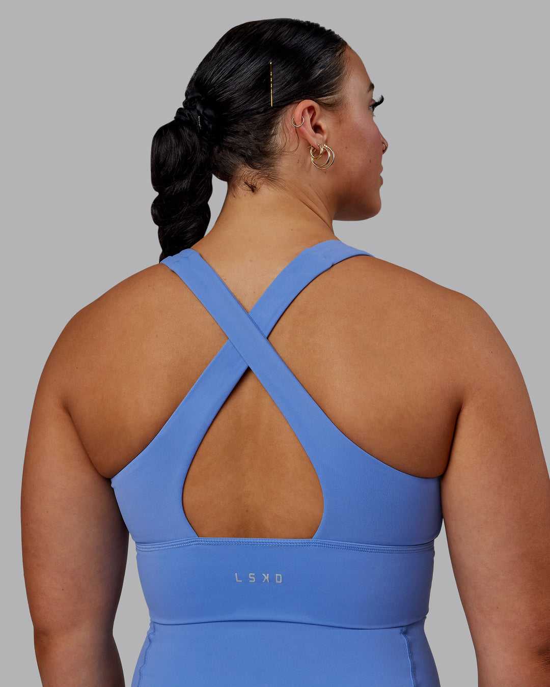 Woman wearing Evoke Sports Bra - Ultramarine - view 2