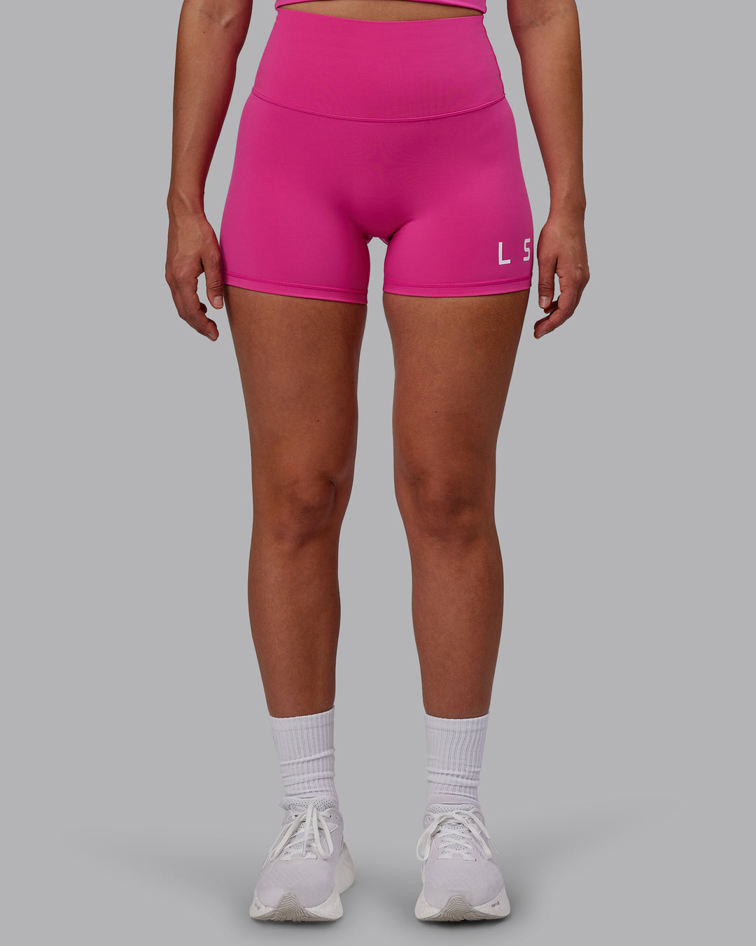 Woman wearing Evolved Ultra High-Rise 4" Short - Fuchsia Pink-White - view 6