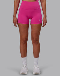 Woman wearing Evolved Ultra High-Rise 4" Short - Fuchsia Pink-White | Thumbnail Index: 5