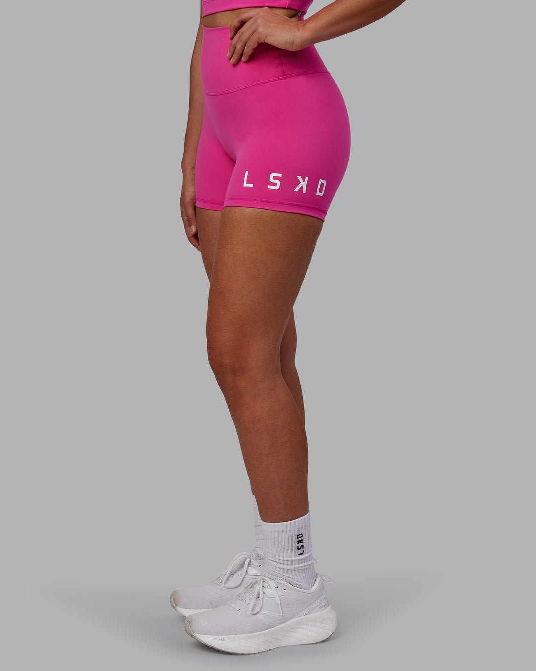 Woman wearing Evolved Ultra High-Rise 4" Short - Fuchsia Pink-White - view 3
