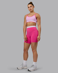 Woman wearing Excel Ultra High-Rise 6" Short - Ultra Pink | Thumbnail Index: 4