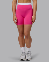 Woman wearing Excel Ultra High-Rise 6" Short - Ultra Pink | Thumbnail Index: 7