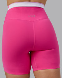 Woman wearing Excel Ultra High-Rise 6" Short - Ultra Pink | Thumbnail Index: 9