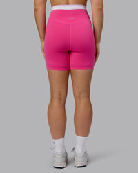Woman wearing Excel Ultra High-Rise 6" Short - Ultra Pink | Thumbnail Index: 6