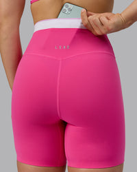 Woman wearing Excel Ultra High-Rise 6" Short - Ultra Pink | Thumbnail Index: 3