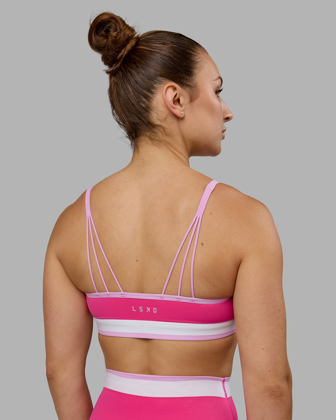Woman wearing Excel Sports Bra - Ultra Pink - view 1