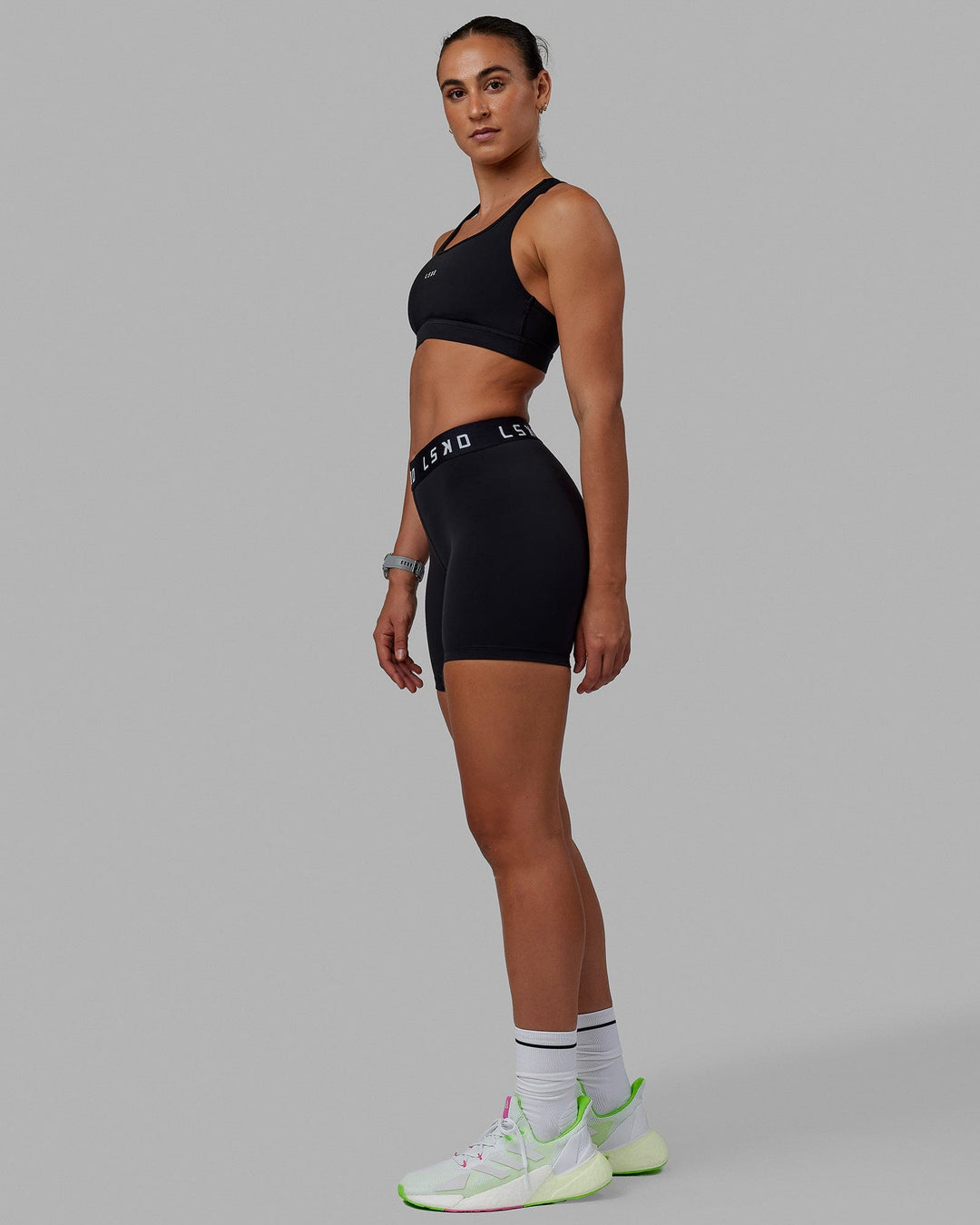 Woman wearing Extend Mid-Rise 6" Short - Black-White - view 8