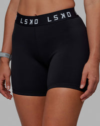 Woman wearing Extend Mid-Rise 6" Short - Black-White | Thumbnail Index: 9