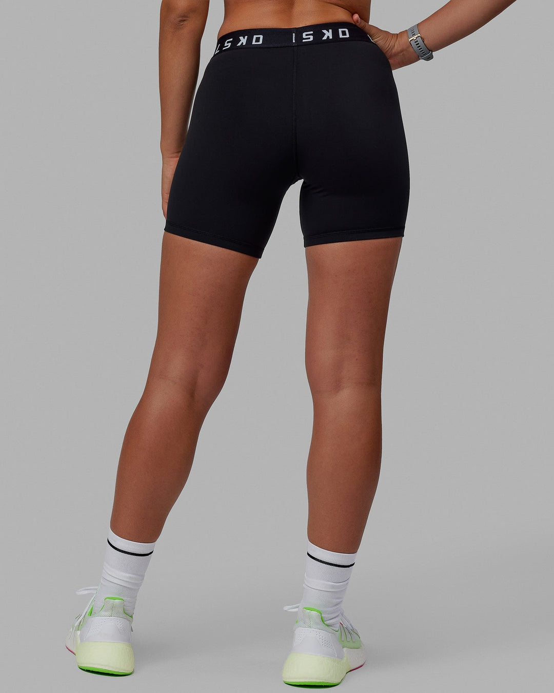 Woman wearing Extend Mid-Rise 6" Short - Black-White - view 4
