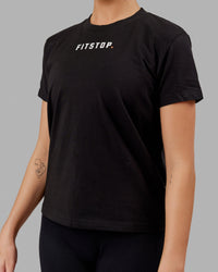 Woman wearing Fitstop Fast Tee - Black | Thumbnail Index: 3