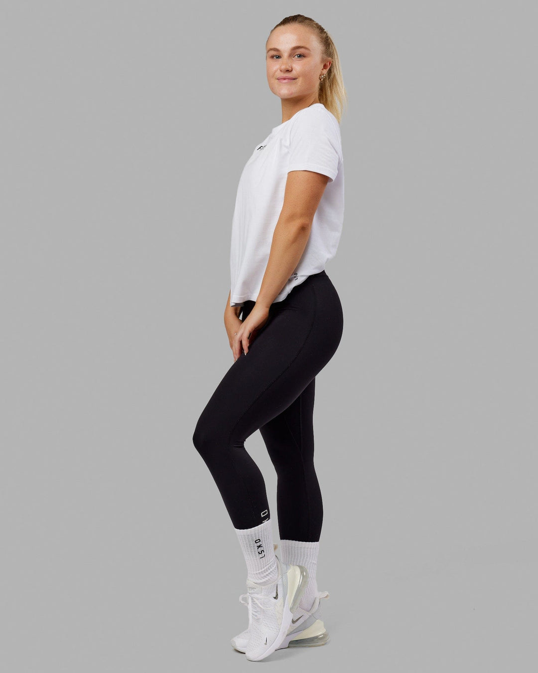 Woman wearing Fitstop Fast Tee - White - view 3