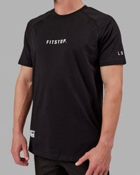 Man wearing Fitstop Optimal Tee - Black | Thumbnail Index: 3