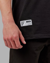 Man wearing Fitstop Optimal Tee - Black | Thumbnail Index: 5