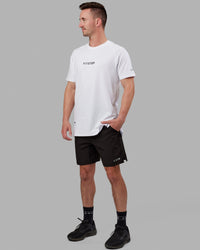 Man wearing Fitstop Optimal Tee - White | Thumbnail Index: 2