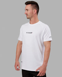 Man wearing Fitstop Optimal Tee - White | Thumbnail Index: 0