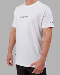 Man wearing Fitstop Optimal Tee - White | Thumbnail Index: 3
