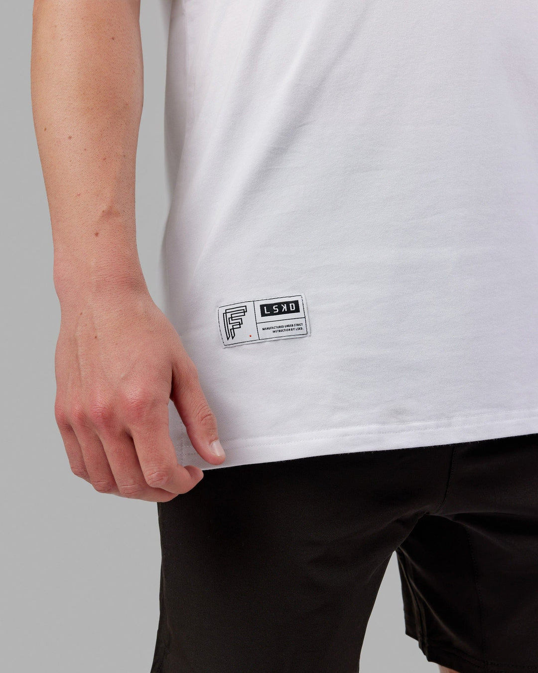 Man wearing Fitstop Optimal Tee - White - view 6