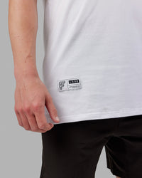 Man wearing Fitstop Optimal Tee - White | Thumbnail Index: 5