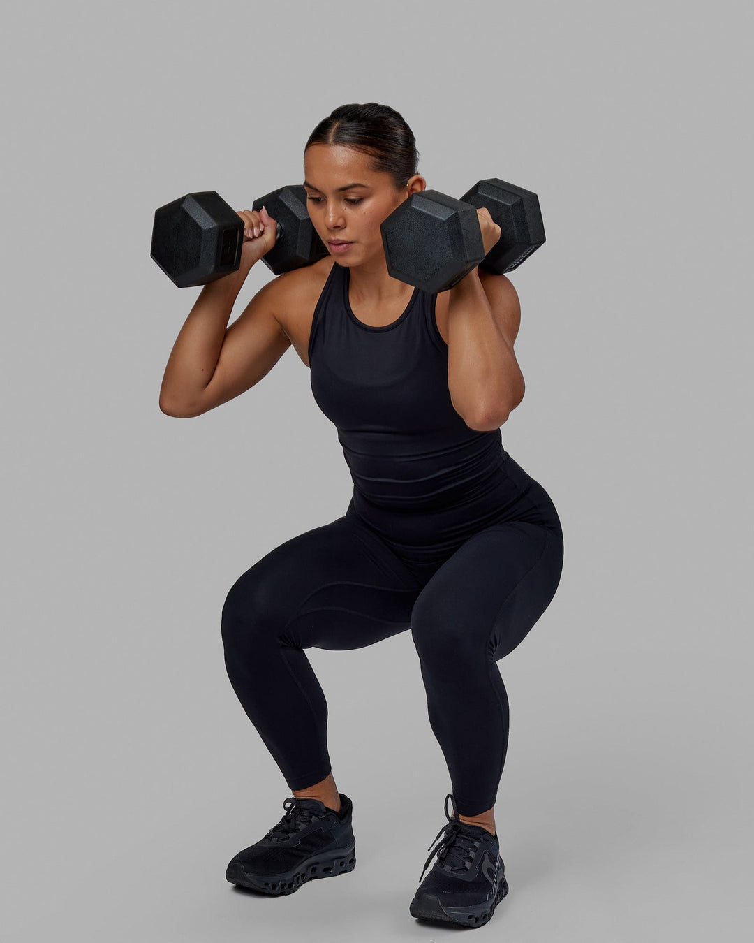 Woman wearing Flow Performance Tank - Black - view 2